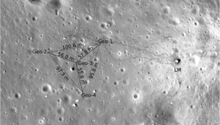 A photo of the surface of the moon with triangular array of seismometers superimposed on top
