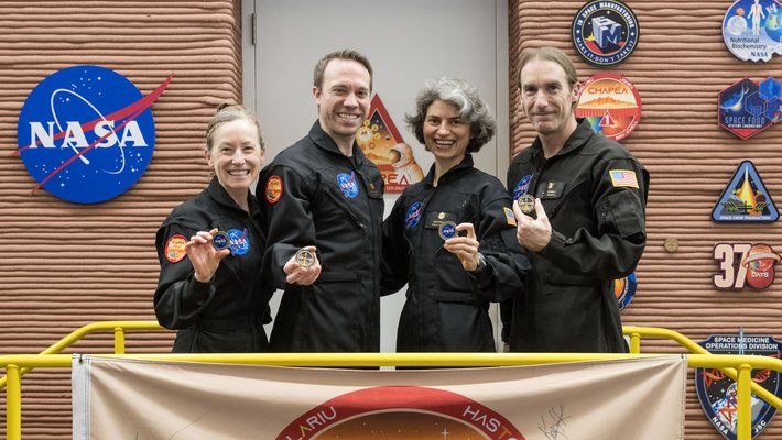 A picture of the four members of the The CHAPEA crew as they leave their simulated Mars mission July 6, 2024, at NASA's Johnson Space Center