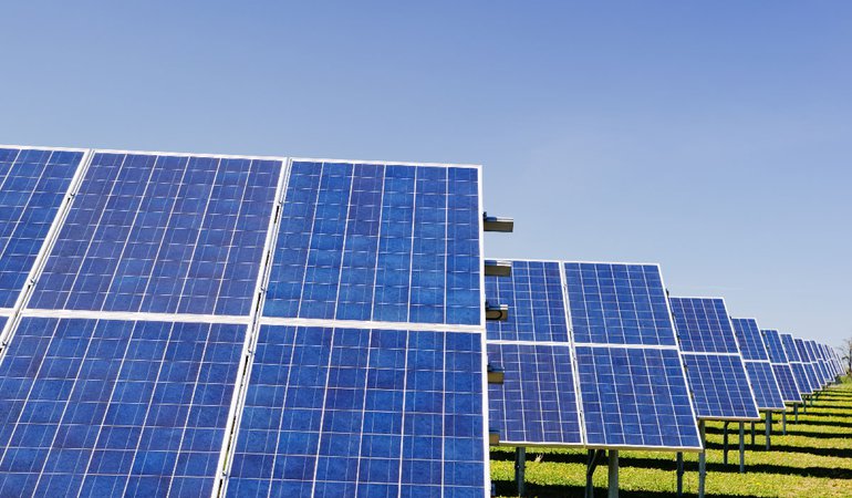 Solar panels in a grassy field