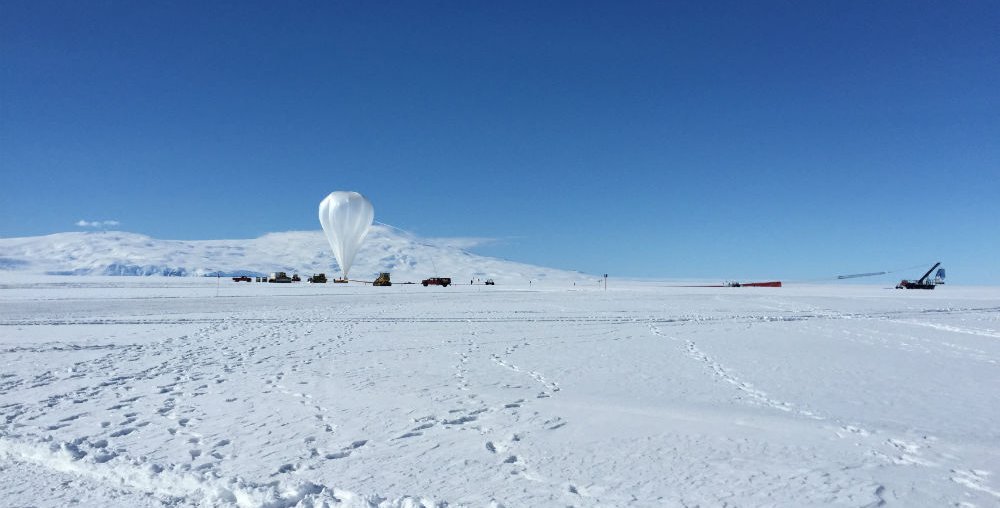 SPIDER and its balloon in the distance; snow in the foreground
